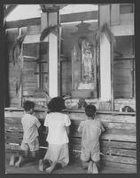 Filipino children in wayside shrine.