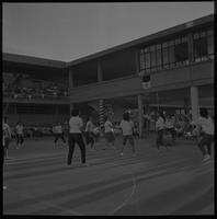Students playing volleyball.