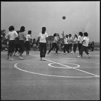 Students playing basketball.