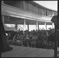 Students watching an outdoor performance.