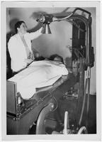 Edith Millican using an x-ray machine.