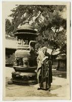 Buddhist Priest by Temple urn.