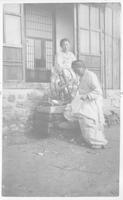 Two women spinning thread in Chaeryŏng, Korea.
