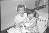 Nurse and patient at the hospital, Taegu, ca. 1963.