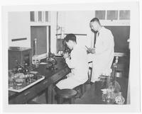 Director of Laboratory and assistant in lab, Presbyterian Hospital, Taegu, ca. 1950.