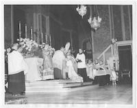 Archbishop receives sacred pallium.