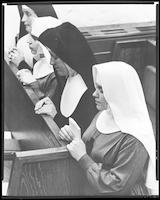 Episcopal, Catholic nuns pray together.
