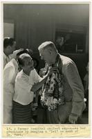 Dr. Edwin Charles Cort receives lei.