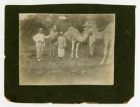 William H. Sheppard with two native men and camels.