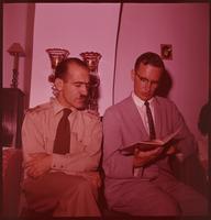 The Rev. Durwood A. Busse and an Iranian army officer singing from a hymnal, circa 1960.