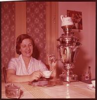 Woman pouring tea.