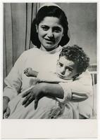 Nurse holds boy with typhoid, Tripoli, Lebanon.