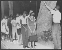 Negroes pray in racial demonstration.