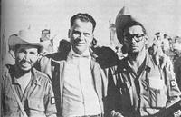 Emilio Rodriguez with rebel fighters.