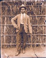 Young man trying on Western clothes.
