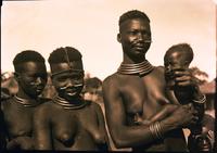 Balualua women with reeds in noses.