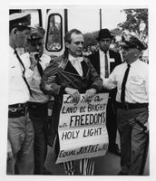 Clergyman arrested in anti-segregation fight.