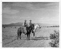 Ralph Hall and Roger Sherman on horseback.