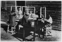 Group of boys in a book binding class.