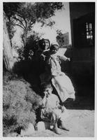 Arab woman with two children.
