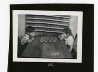 Children playing checkers.